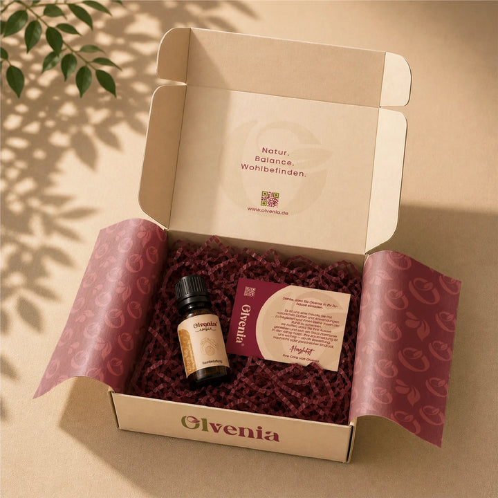 Olvenia Ambia Zitronenöl Bio in geöffneter Geschenkbox mit Seidenpapier, Füllmaterial und Dankeskarte