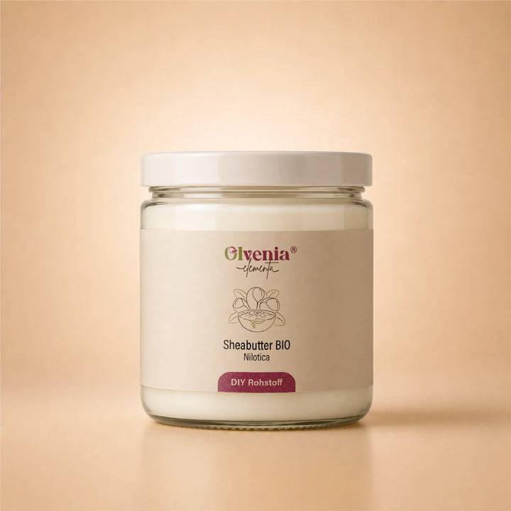 Olvenia Elementa Sheabutter Bio Nilotica im Glas als DIY-Rohstoff auf warmem beigem Hintergrund